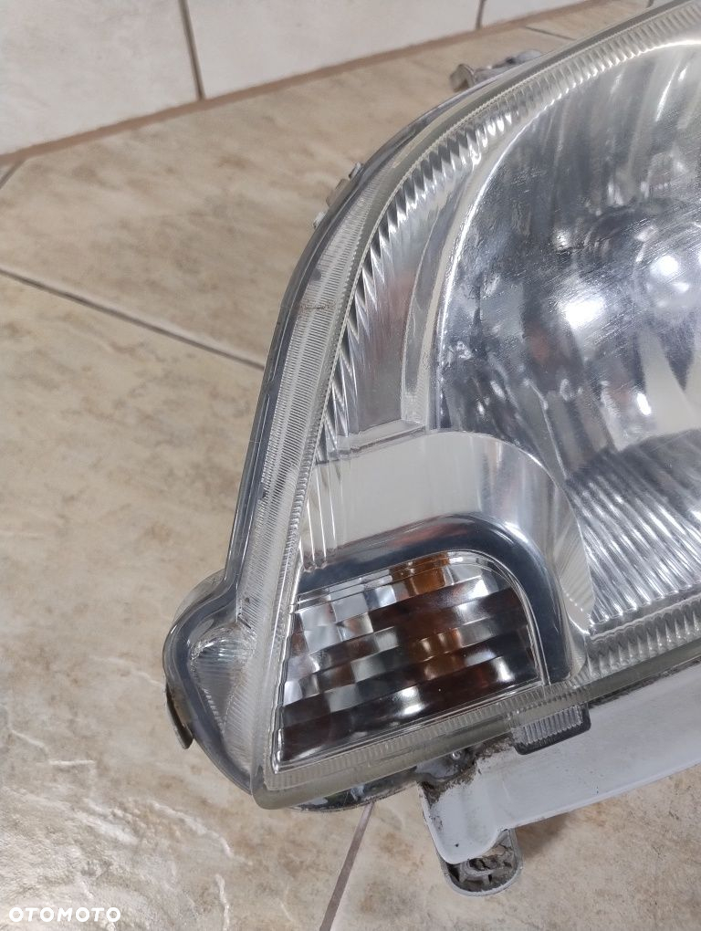 Daihatsu cuore 03-07 lampa lewa przód reflektor Europa wysyłka OLX - 2