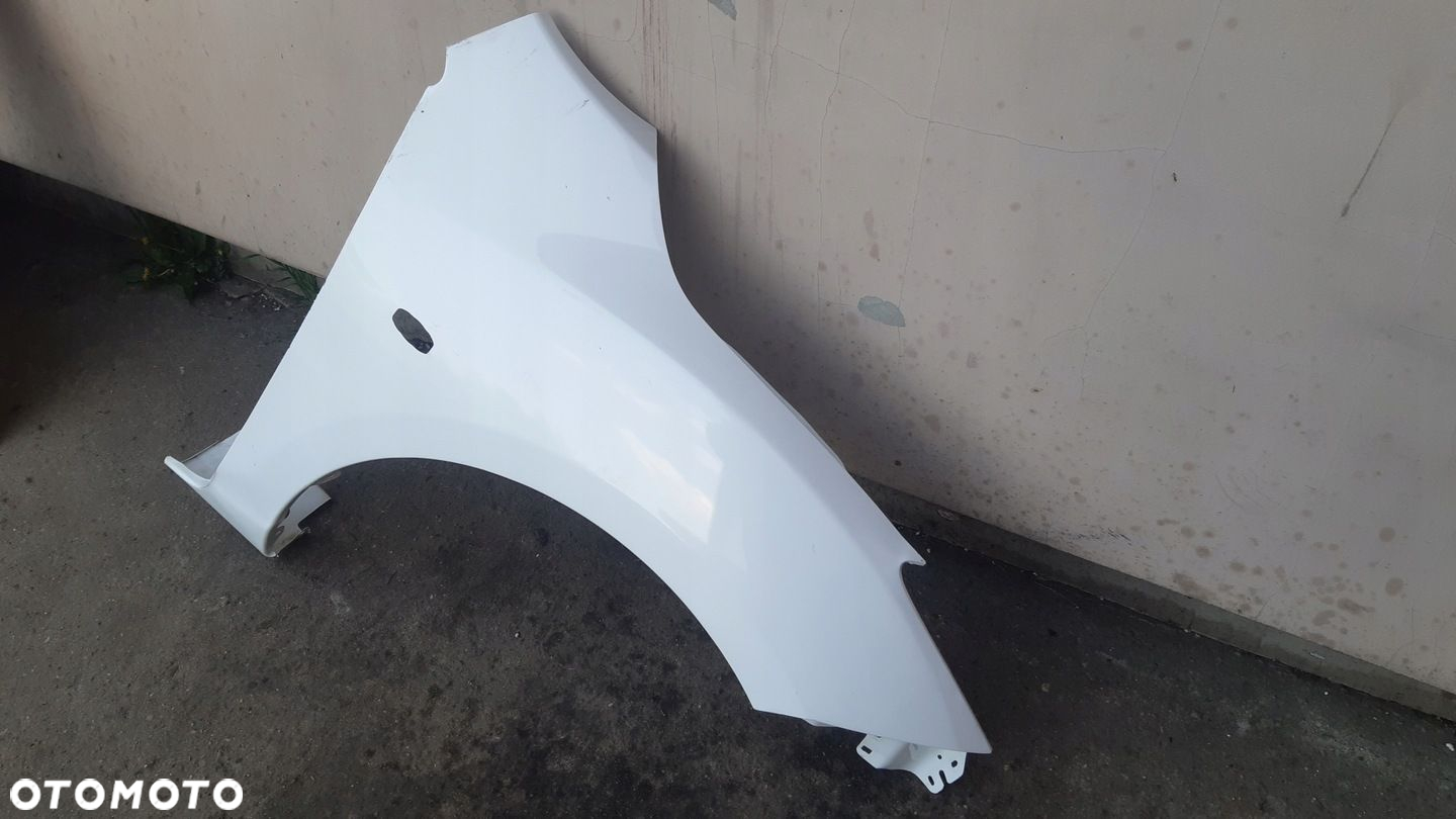 Blotnik prawy przod MAZDA 3 III 08-13r - 3