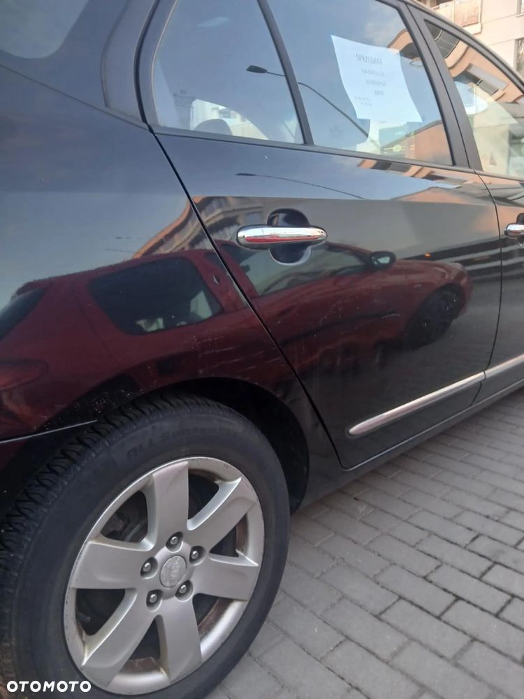 Kia Carens 2.0 CVVT Spirit - 7