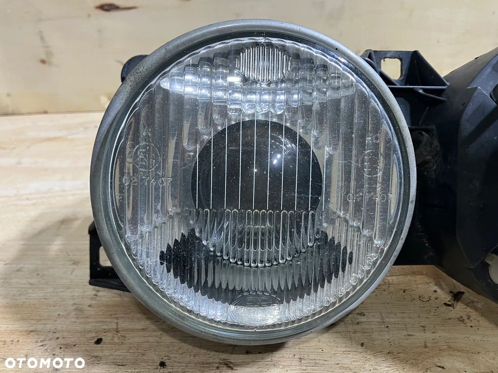 LAMPA BMW E30 HELLA PRAWA UŚMIECH REFLEKTOR E32 E34 - 3