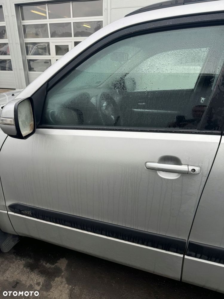 Grand Vitara II 05-10r 2,0 16V drzwi przód lewy - 1