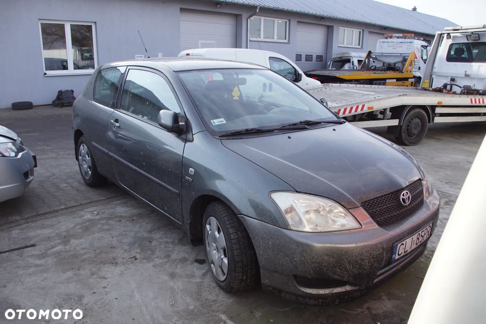 Auto na części - Toyota Corolla E12 1.4 VVT-i 97 KM 4ZZ-FE MTM 1C3 2002R Silnik Skrzynia Drzwi Maska Klapa Zderzak Błotnik Szyba Klamka Lampa Lusterko Deska Kokpit Sterownik Moduł Czujnik Licznik Panel Kierownica - 7
