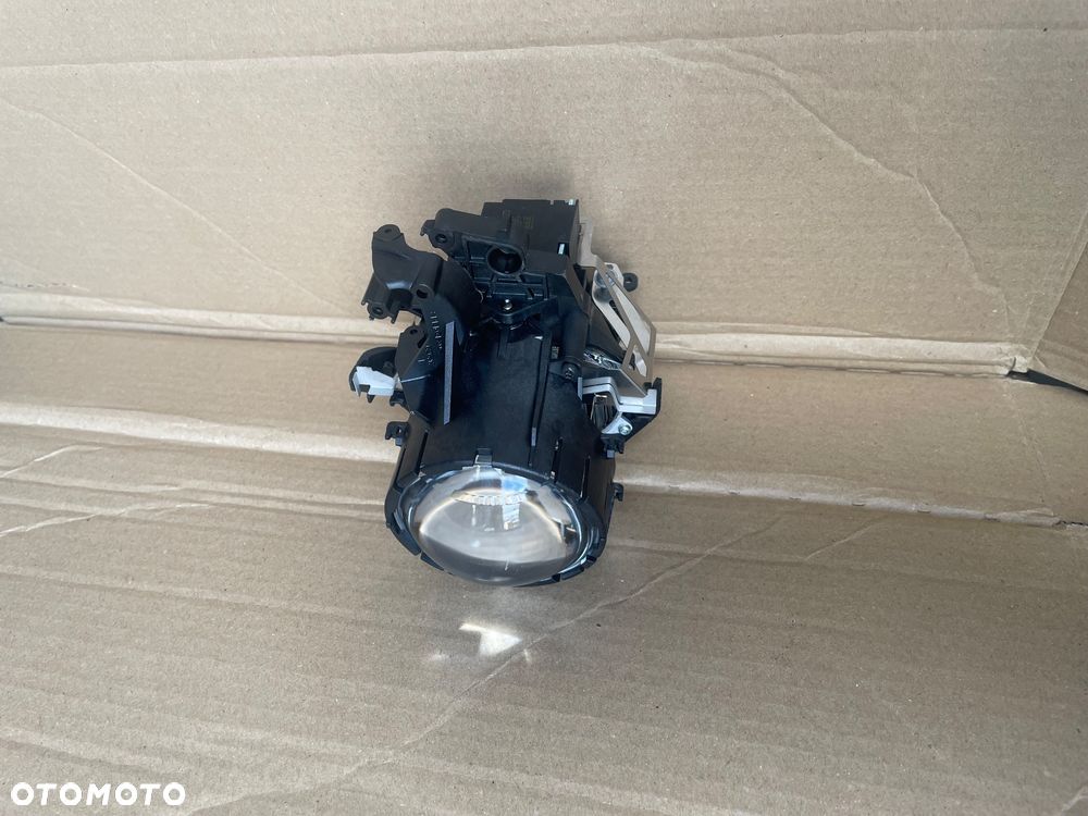 62611913 Soczewka lampy xenon bmw e90 e91 - 1