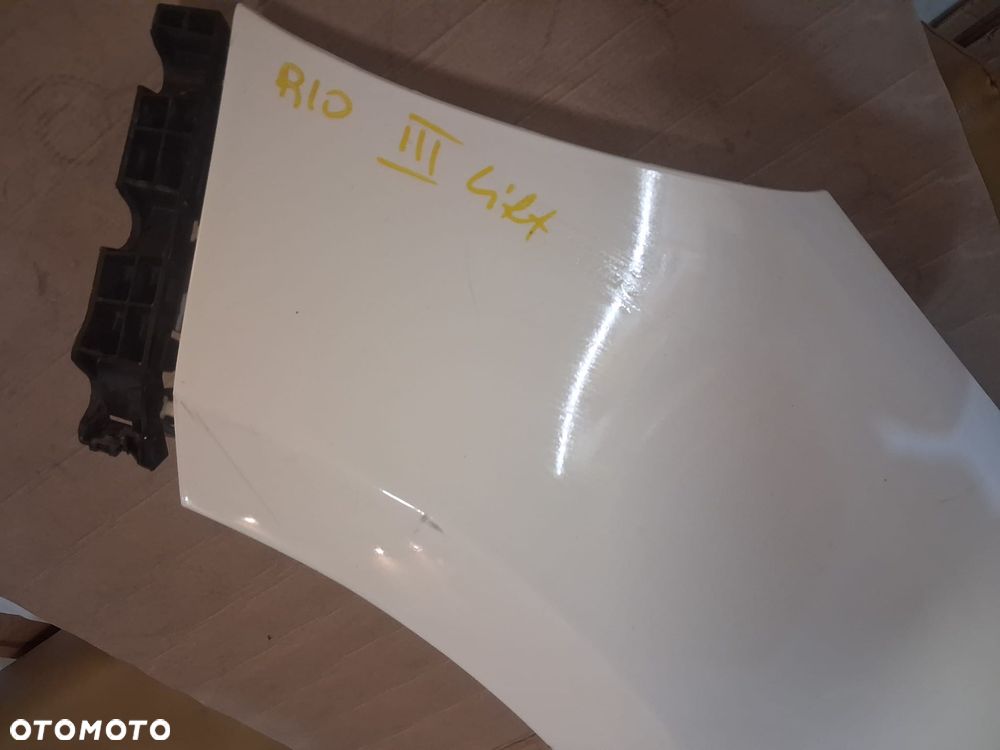 Błotnik KIA RIO III LIFT  lewy  biały kol UD - 7