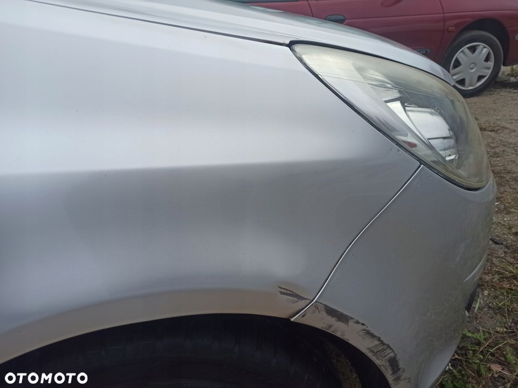 Błotnik prawy przód OPEL CORSA D Z157 06-11 - 4