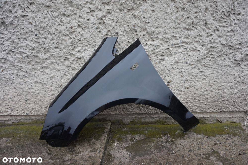 BŁOTNIK PRZEDNI LEWY OPEL CORSA D Z22C