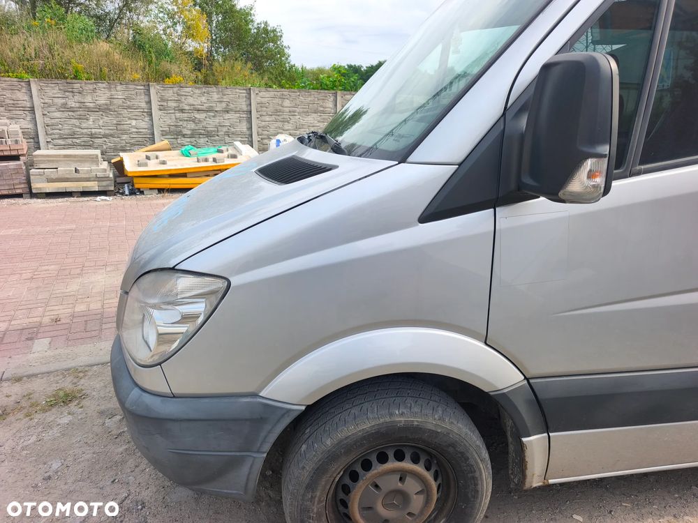 Błotnik lewy Mercedes Sprinter w906 przedlift srebrny L766 06-13r