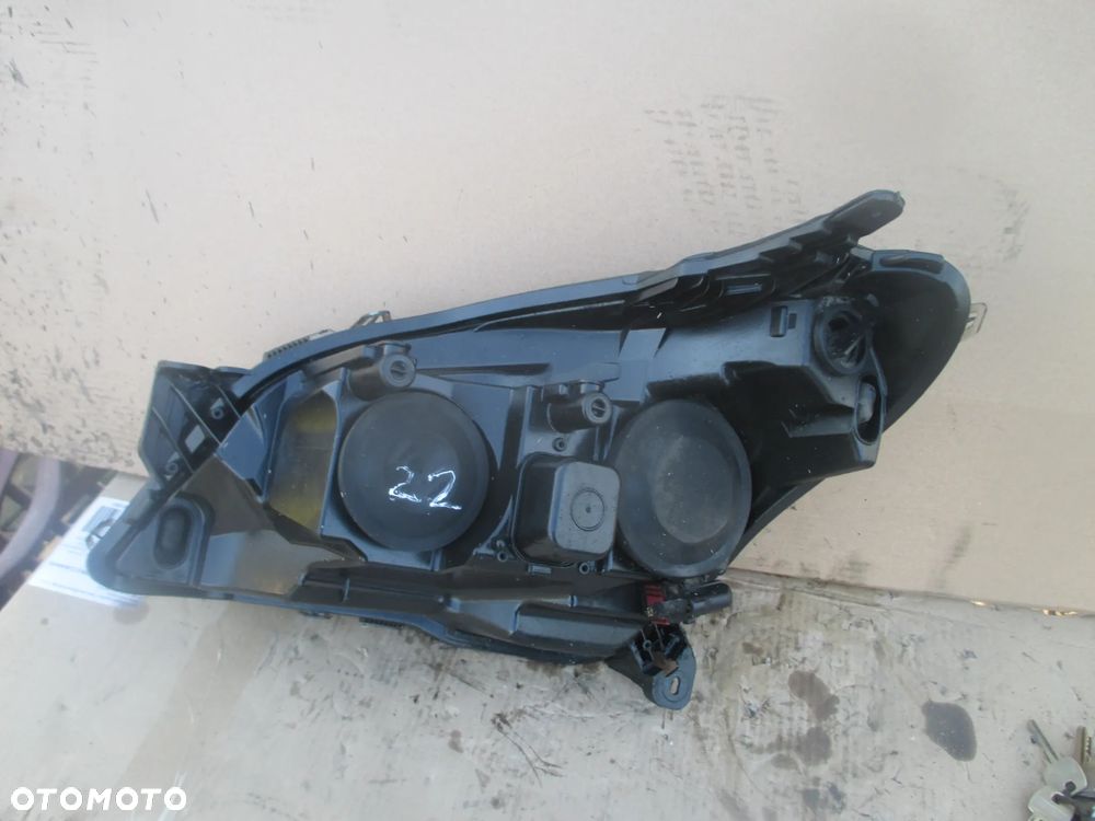 lampa prawa Opel Astra 3 H Hella Europa - 7