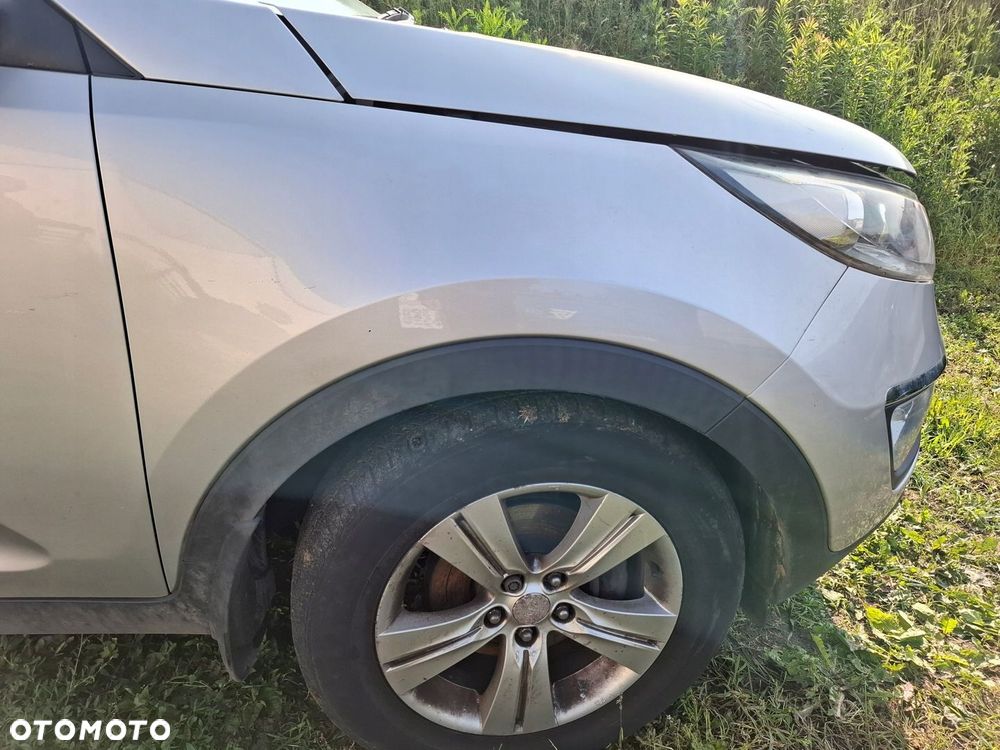BŁOTNIK PRAWY PRZÓD KIA SPORTAGE III 9S 2011 ROK - 1