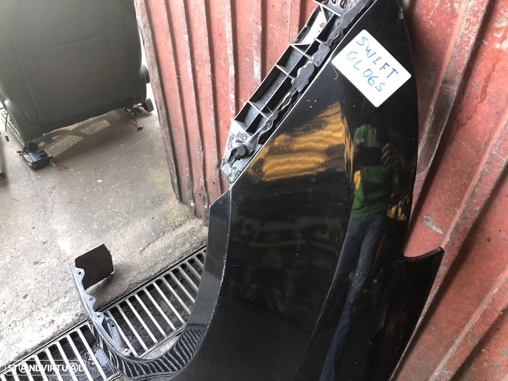 SUZUKI SWIFT GUARDA LAMAS ESQUERDO - GL065 - 2