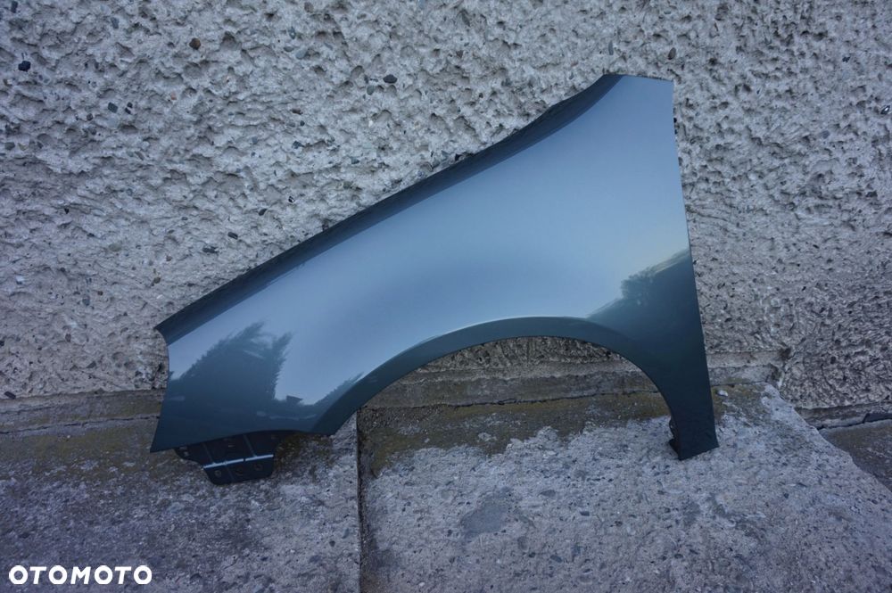 BŁOTNIK PRZEDNI LEWY VW GOLF V 5 LA6Q