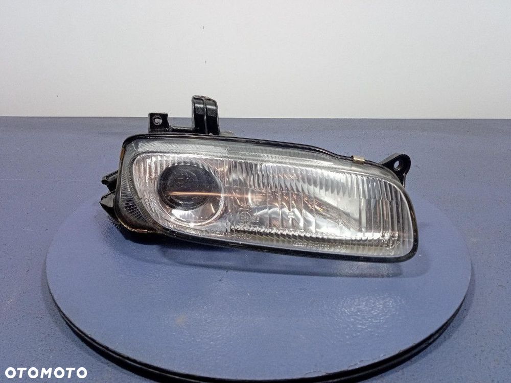 MAZDA 323F BA 94- REFLEKTOR PRAWY LAMPA PRZÓD 110-61708 - 1
