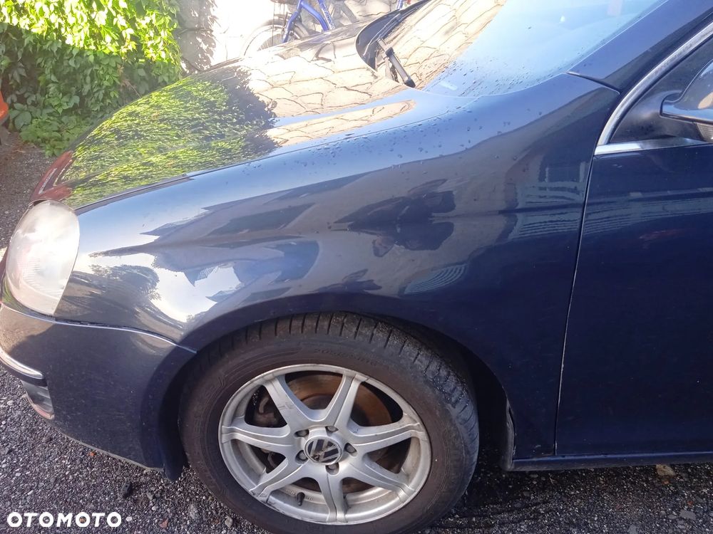 Błotnik lewy Golf V kombi lak. LC5F - 1