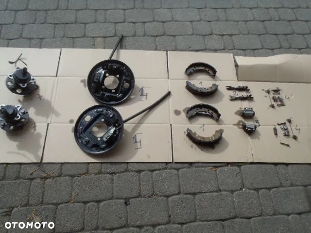 bęben szczęki cylinderek rozpierak hamulec tylny osłona tarcza kotwiczna kostka abs z zawieszenie tył toyota yaris II III 2 3 jak nowe - 1