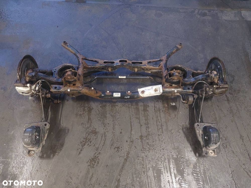 BELKA OŚ ZAWIESZENIA TYŁ TARCZE Z ABS SKODA OCTAVIA II HB 5D - 1