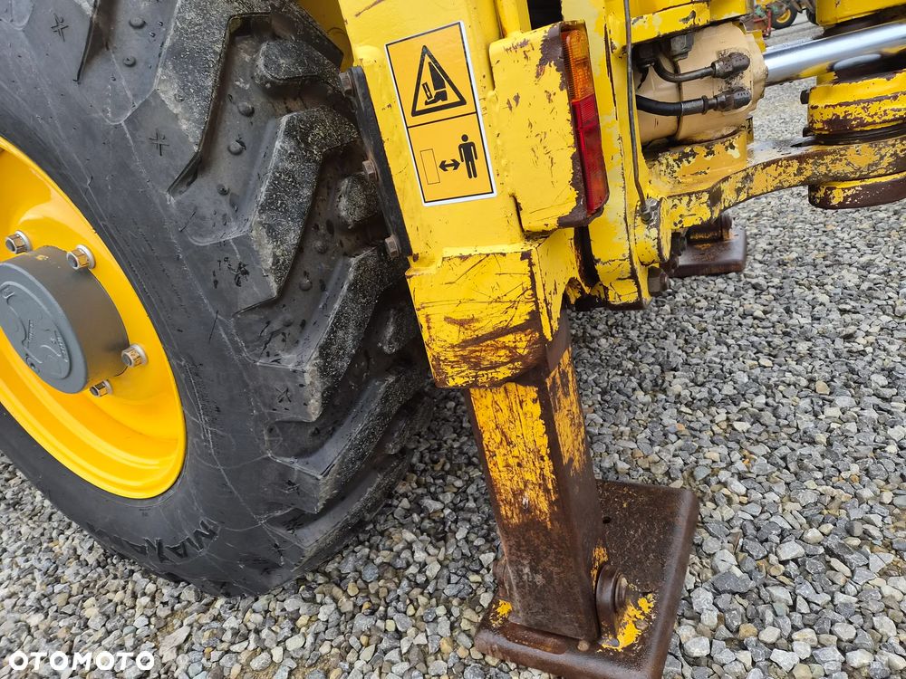 New Holland LB 115 - 21