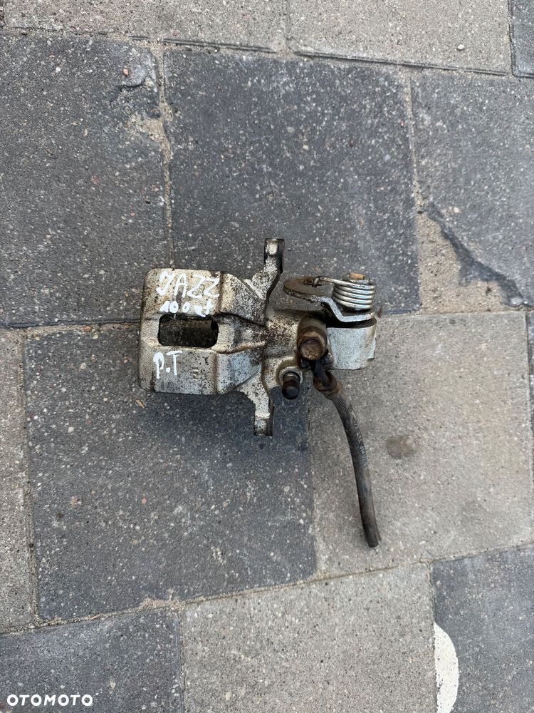 ZACISK PRAWY TYŁ HONDA JAZZ 02-08 JAK NOWY