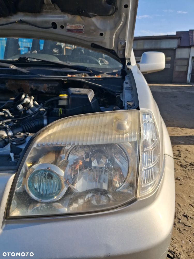 Nissan x-trail 06 reflektor lewy - 1