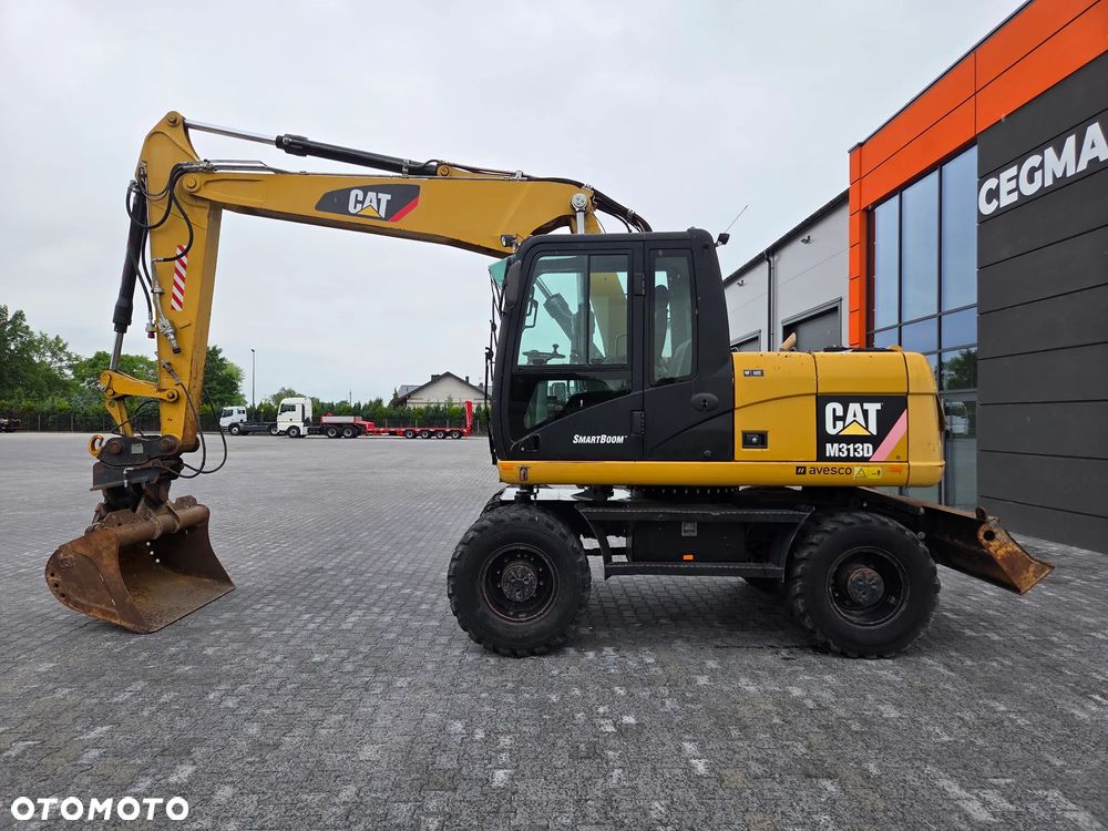 Caterpillar M313D / spr. ze Szwajcarii / - 2