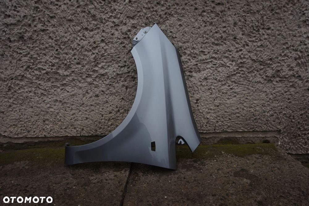 BŁOTNIK PRZEDNI LEWY OPEL CORSA D Z179 - 2