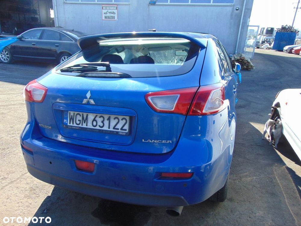 ZDERZAK TYŁ TYLNY MITSUBISHI LANCER VIII D06 - 1