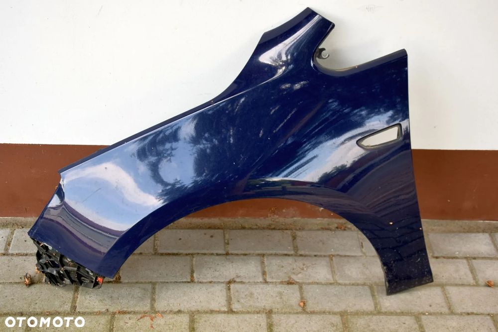 Opel Astra J Błotnik lewy przód przedni Z20Z niebieski - 1