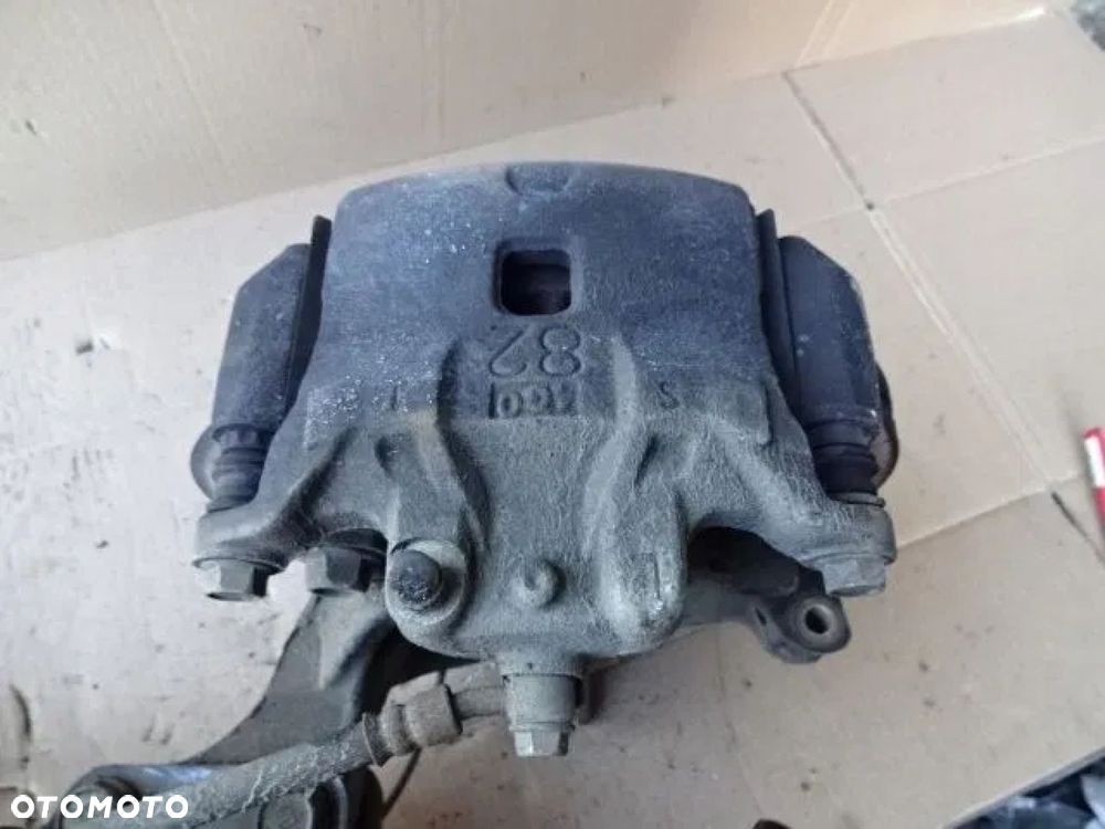 NISSAN PULSAR 1,5 DCI ZACISK HAMULCOWY LEWY PRZÓD - 1