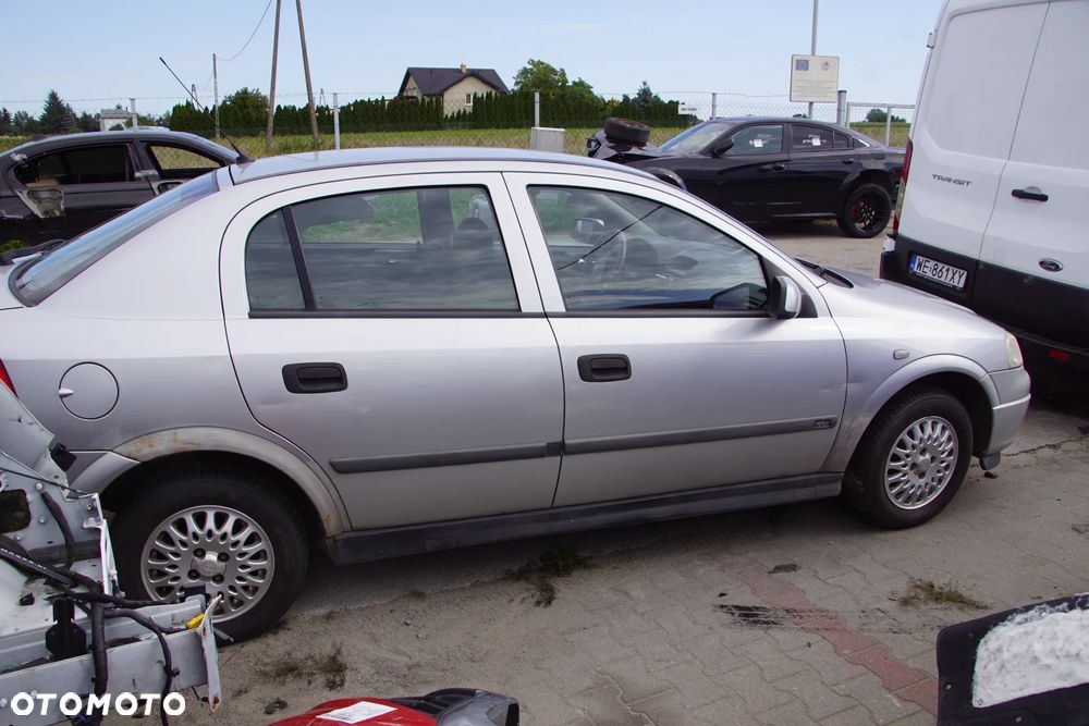 Auto na części - Opel Astra II G 1.6 16V 101 KM X16XEL F17 Z147 1999R Silnik Skrzynia Drzwi Maska Błotnik Zderzak Klapa Lampa Lusterko Klamka Szyba Deska Kokpit Sterownik Moduł Czujnik Licznik Panel Kierownica - 6