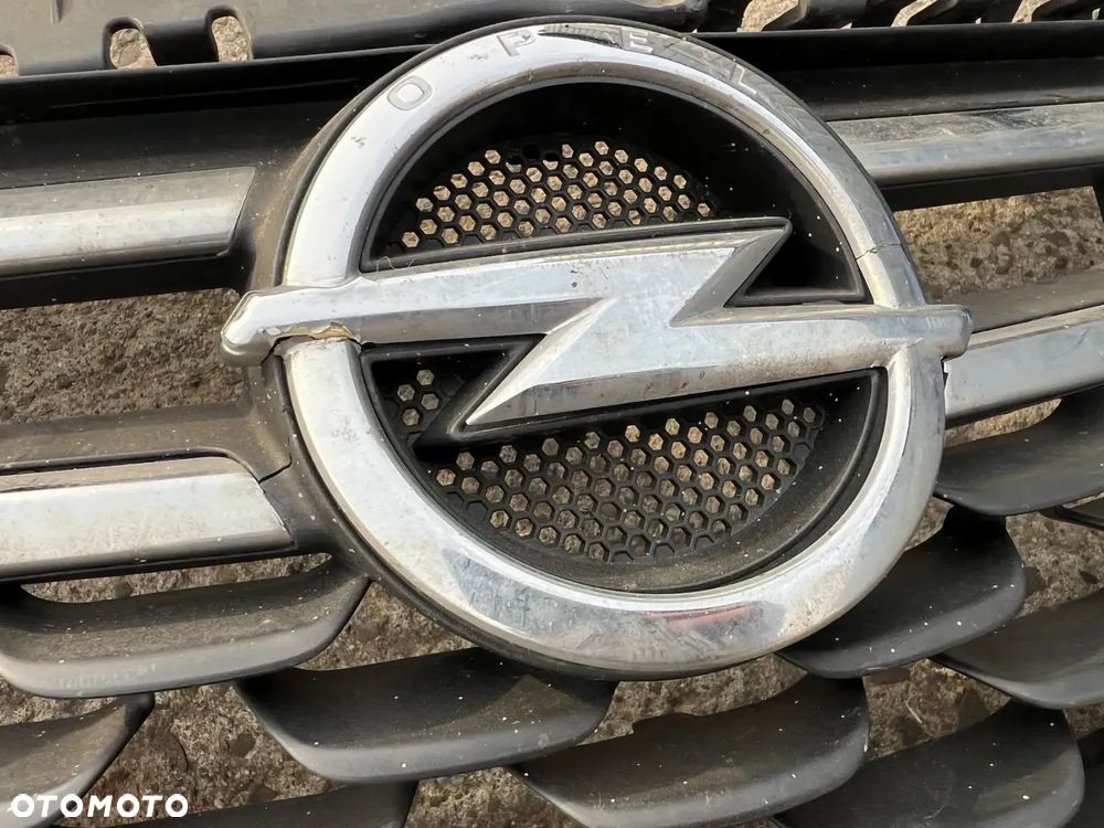 OPEL ASTRA V K ATRAPA GRILL PRZÓD ORYGINAŁ Szkielet 13464791 - 2