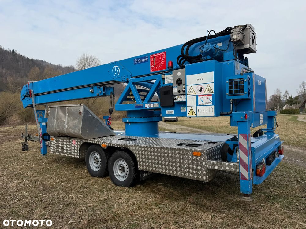 KLAAS K21/31TSR Dźwig Dekarski żuraw zwyżka podnośnik 31m. udźwig 1800kg max. Silnik Yanmar 3cyl. Kosz pojemnik. Dźwig Sterowany całkowicie zdalnie z pilota. Do 3,5 tony Transportowanie samochodem osobowym! Podwieszana oś Hydr. Własny Napęd Hydr. na 2 koła w terenie. Maszyna jak Nowa 2 tyś mtg. 2015r. Po serwisach Dekra. Sprowadzona z Norwegii. Nie różni się od nowej z salonu. Pełna Hydraulika w maszynie. Najbogatsza wersja. OKAZJA  230volt. Zero zużycia! - 2