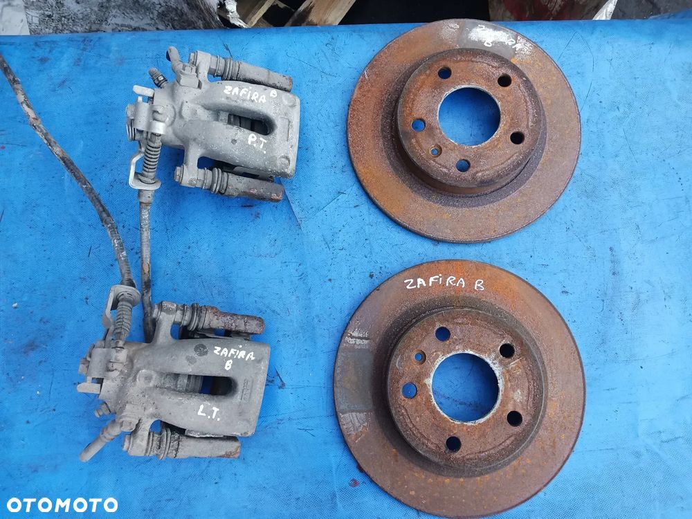 Zacisk tył Opel Zafira B Meriva B Astra H prawy lewy TRW Tarcze - 1