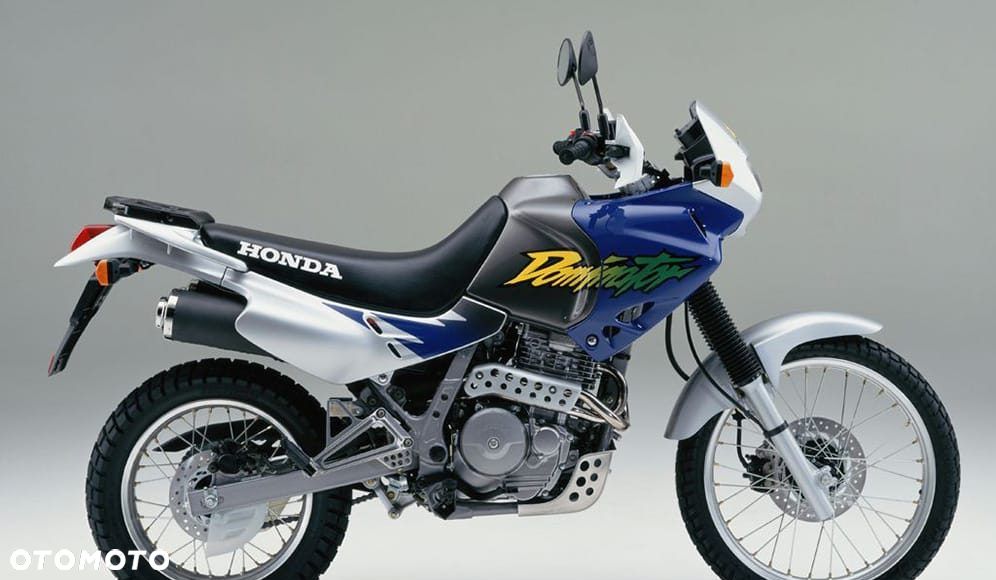 HONDA DOMINATOR 650 reflektor lampa czasza owiewka wypełnienie licznik błotnik kierownica lusterko manetka felga tarcza zacisk pompa zawieszenie silnik moduł regulator zbiornik siedzenie set podnóżek stelaż stopka chłodnica tłumik - 2
