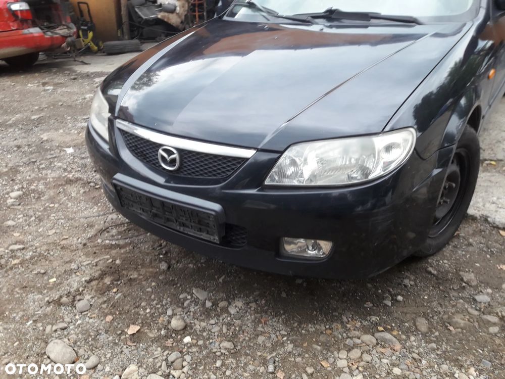 Mazda 323 323f BJ 01-03 Lift  Maska lampa zderzak pas atrapa 22V - 9
