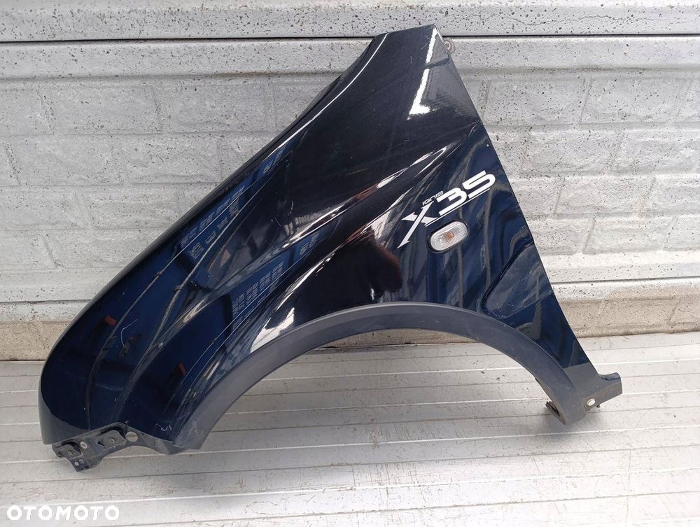 SUZUKI IGNIS II 2 2003-2010 BŁOTNIK PRZEDNI LEWY ORYGINAŁ - 1