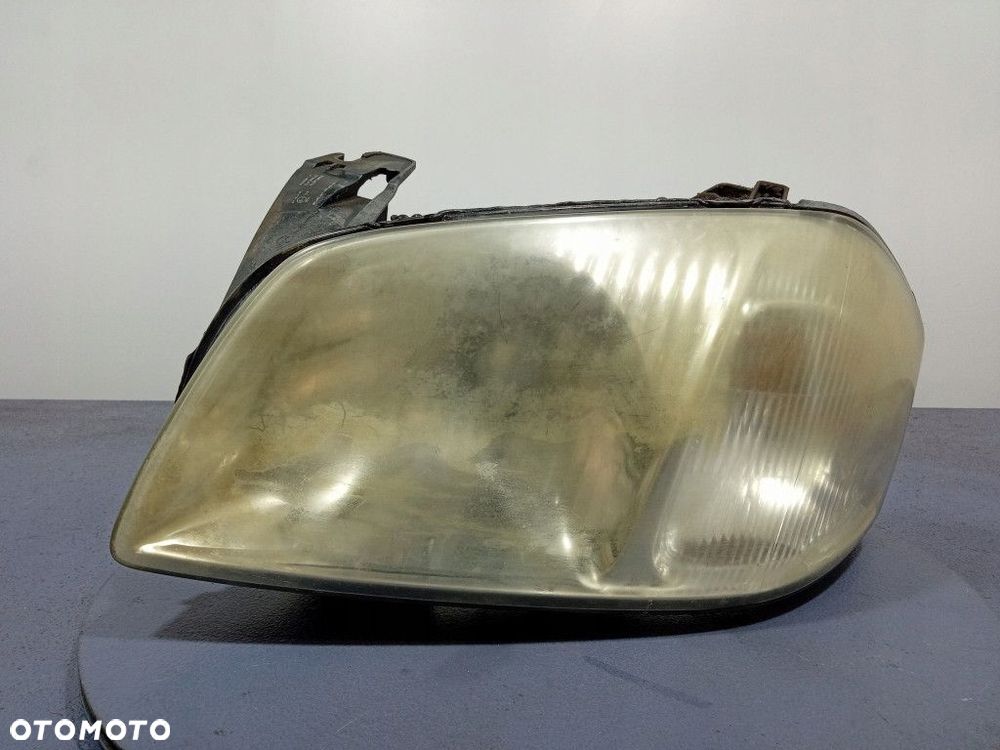 MAZDA TRIBUTE I EP 00-04 REFLEKTOR LEWY LAMPA EU YL8X13006C - 1