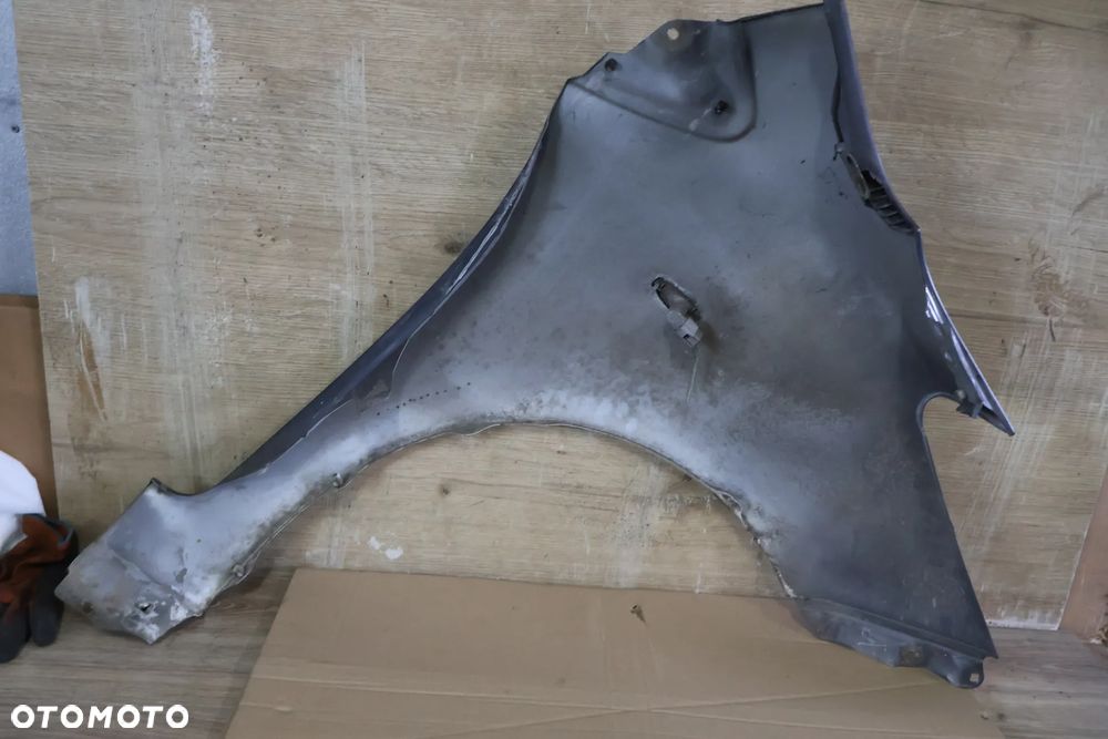 TOYOTA YARIS II 2 LIFT 09-11 BŁOTNIK LEWY PRZÓD PRZEDNI 1G3 - 11