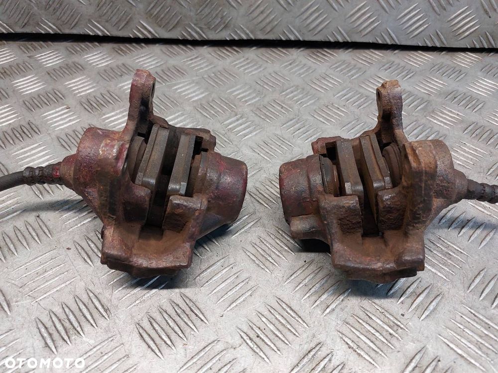 TARCZE HAMULCOWE TYŁ + ZACISKI MERCEDES W210 E200  2.3 - 2