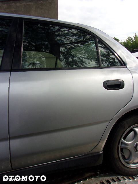DRZWI MITSUBISHI CARISMA 95-99 LEWE TYLNE - 1