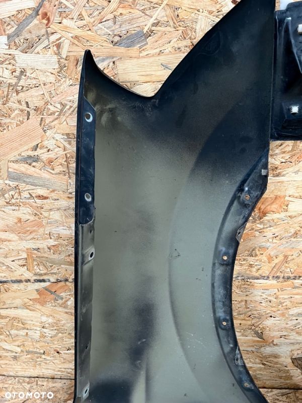 BŁOTNIK LEWY NISSAN QASHQAI J10 Kod lakieru: Z11 - 11