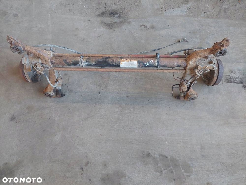 BELKA OŚ ZAWIESZENIA TYŁ BĘBNY BEZ ABS  PEUGEOT 206 I - 2