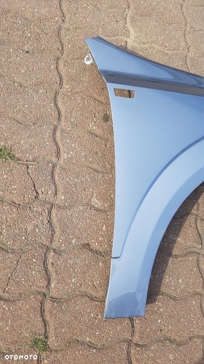 Błotnik przód  prawy  Opel Astra H III kod lakieru Z163 - 2