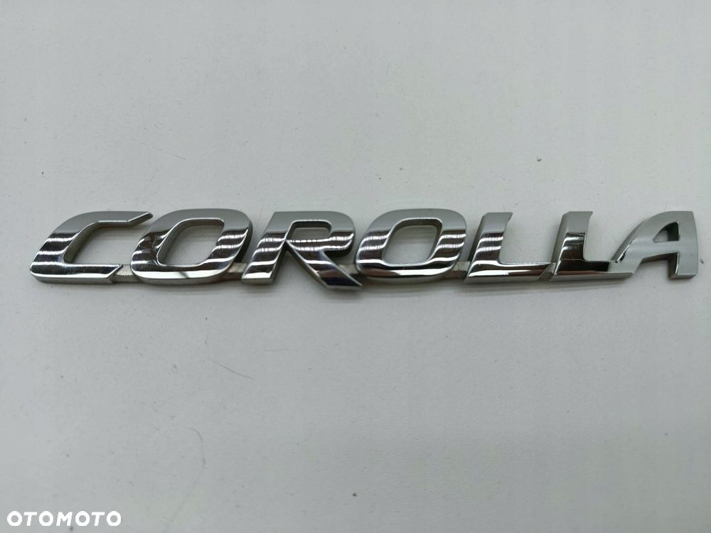 TOYOTA COROLLA ZNACZEK EMBLEMAT LITERY MODELU TYŁ - 1