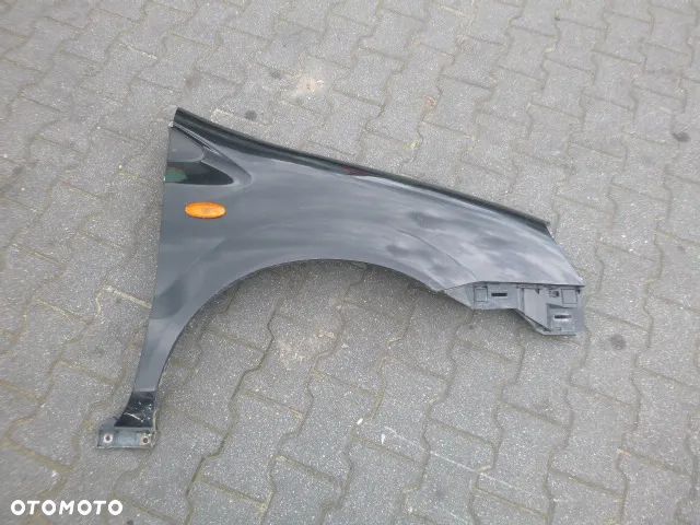 BŁOTNIK PRAWY PRZÓD PRAWY PRZEDNI NISSAN ALMERA TINO