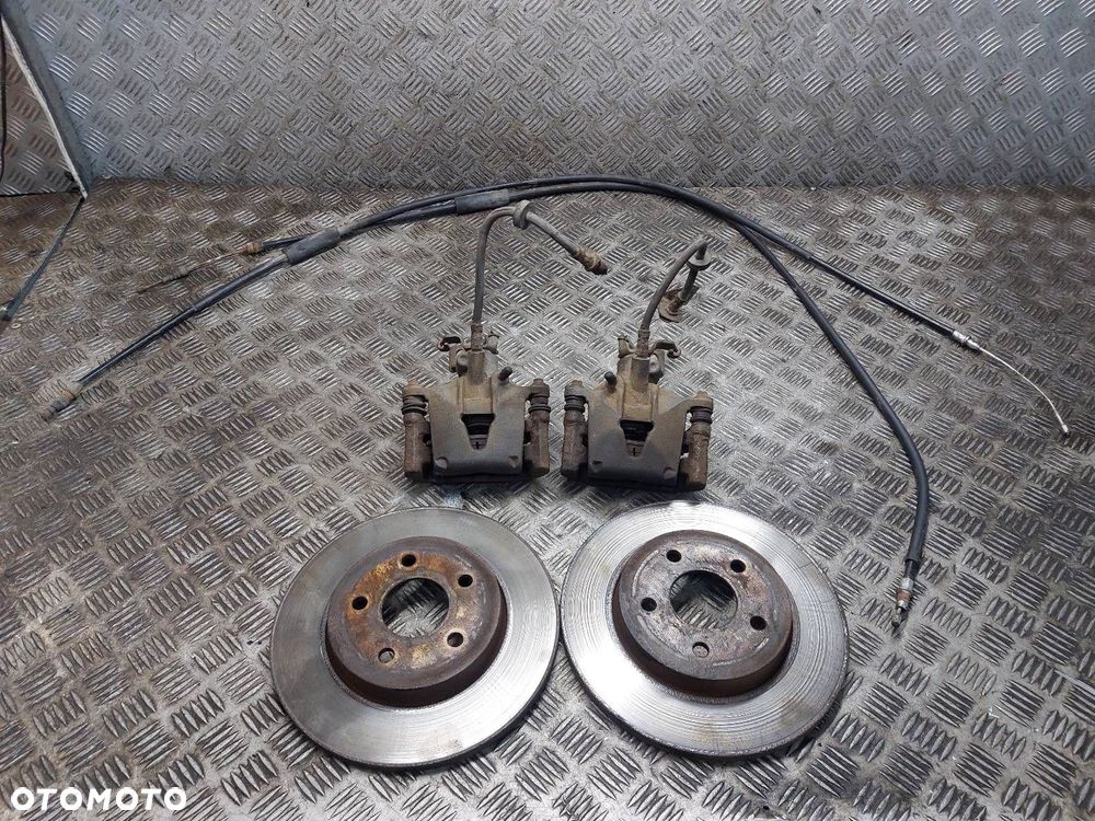 TARCZE HAMULCOWE TYŁ + KLOCKI + ZACISKI FORD MONDEO MK3 HB 5D - 1