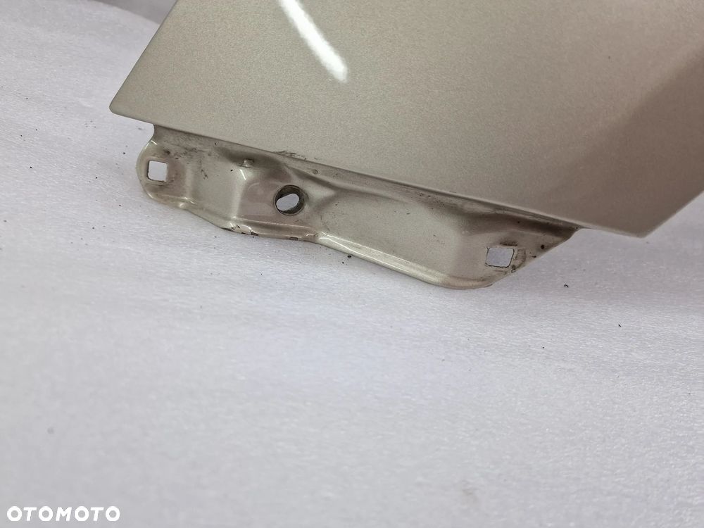 TOYOTA YARIS II LIFT 09-11 LEWY ŁADNY BŁOTNIK PRZEDNI PRZÓD , BEŻOWY METALIK , NR AUKCJI BŁ57 - 14