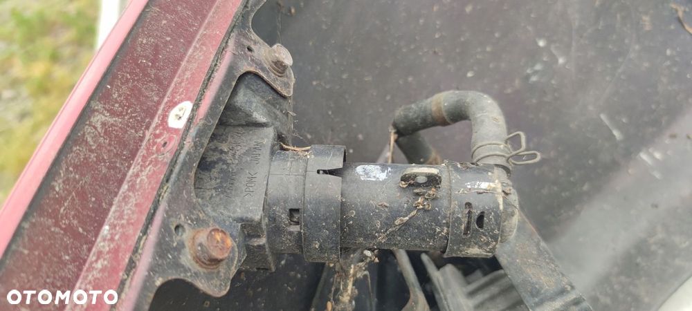 SPRYSKIWACZ REFLEKTORA LAMPY LEWY LANCER VII R20 - 1