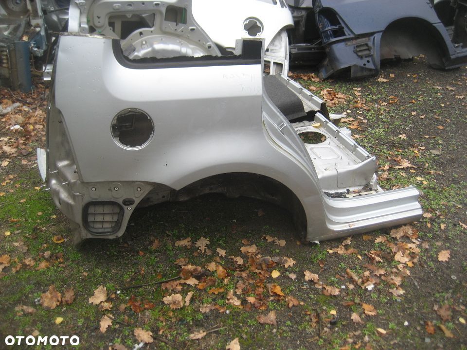 vw touran 03-09r błotnik tył prawy kod lakieru LA7W