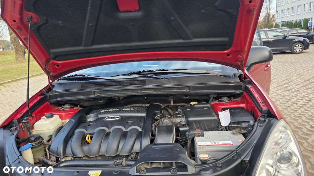 Kia Carens 2.0 CVVT EX Top - 36