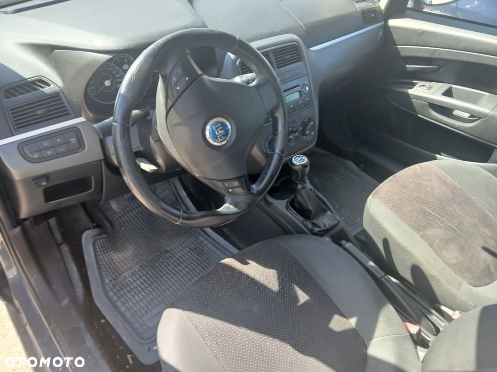 Fiat Grande punto 5d 1.2 MPI 8V CF4 65km 199 A4.000 silnik skrzynia napęd sanki belka wahacz wahacze zacisk zaciski zwrotnica piasta kopyto mc person amortyzator - 11