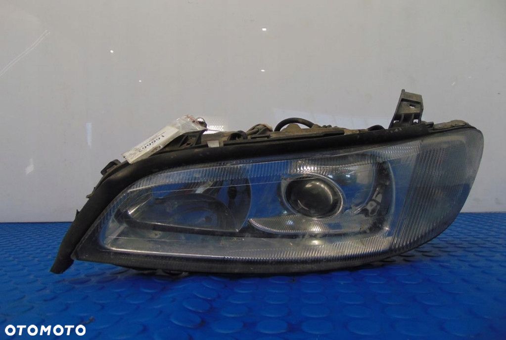 OPEL OMEGA 3.0 REFLEKTOR LEWY - 1